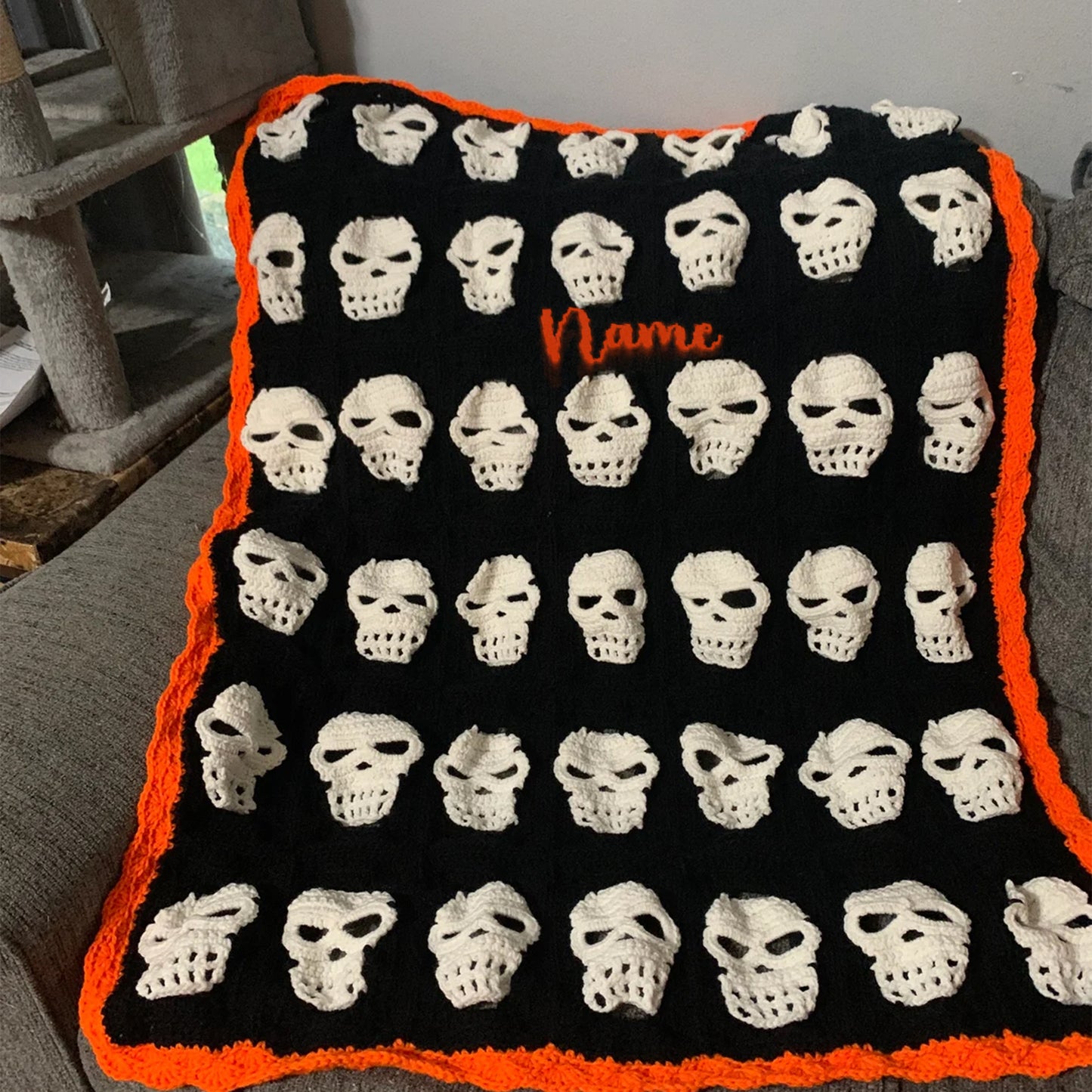 Skull Crochet Throw Blanket – Halloween Black and White Skeleton Afghan with Orange Border – Spooky Cozy Gothic Home Decor