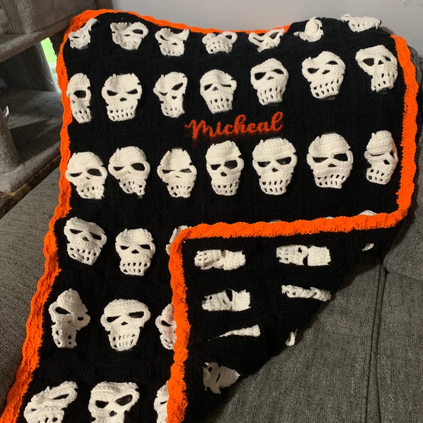 Skull Crochet Throw Blanket – Halloween Black and White Skeleton Afghan with Orange Border – Spooky Cozy Gothic Home Decor