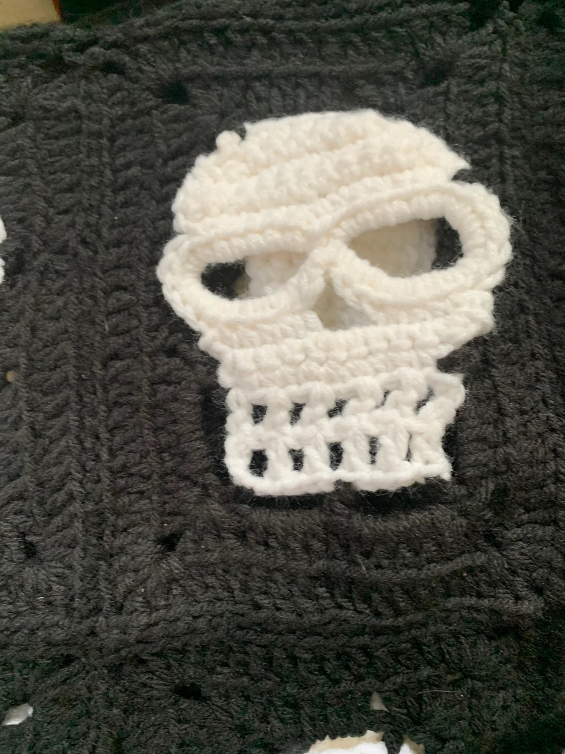 Skull Crochet Throw Blanket – Halloween Black and White Skeleton Afghan with Orange Border – Spooky Cozy Gothic Home Decor