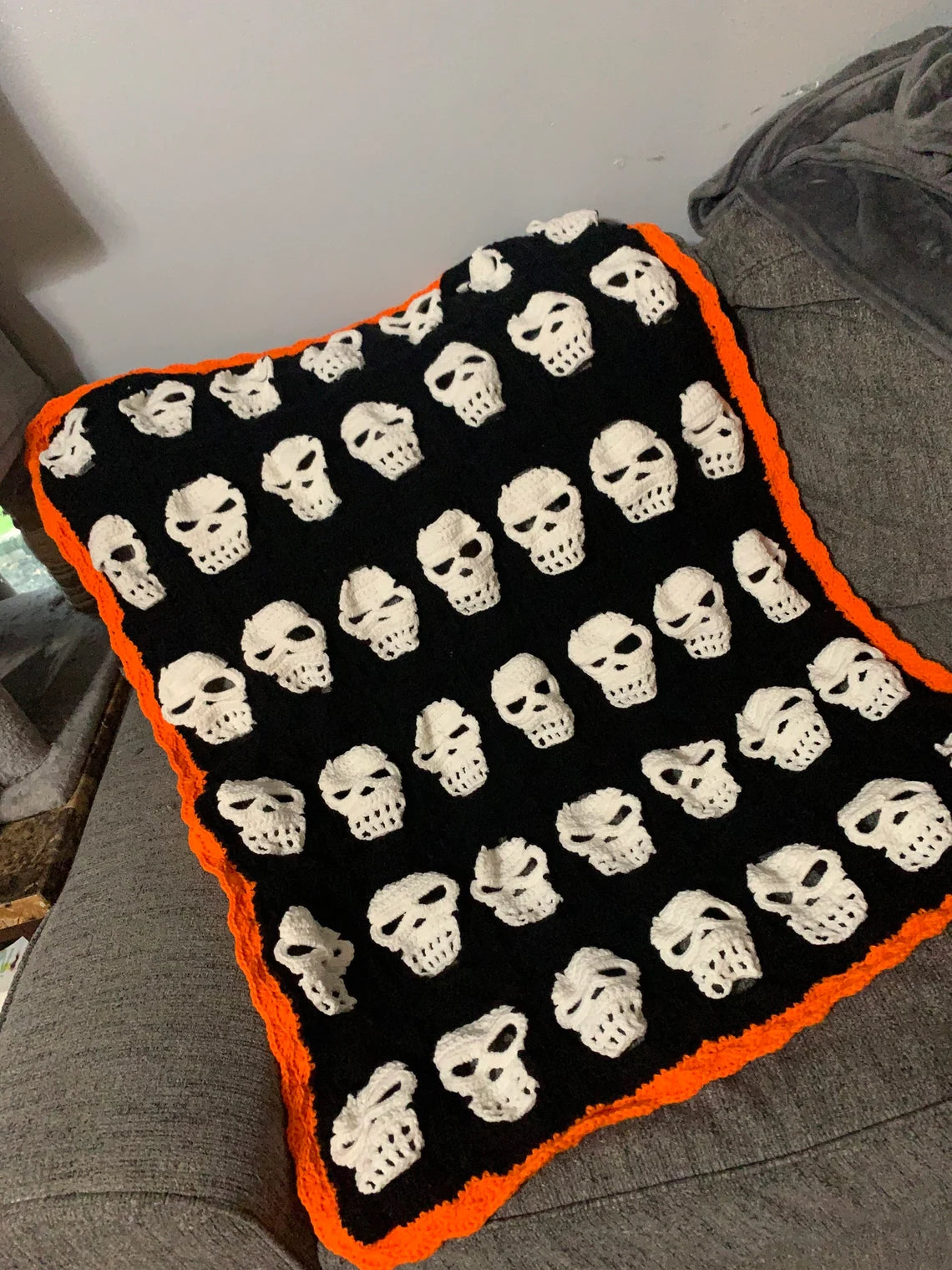 Skull Crochet Throw Blanket – Halloween Black and White Skeleton Afghan with Orange Border – Spooky Cozy Gothic Home Decor