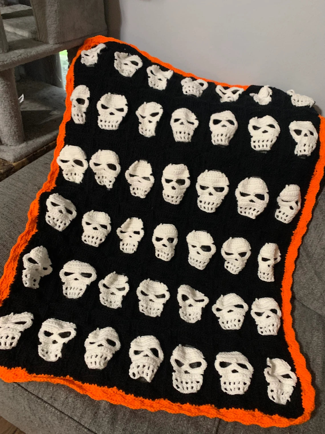 Skull Crochet Throw Blanket – Halloween Black and White Skeleton Afghan with Orange Border – Spooky Cozy Gothic Home Decor