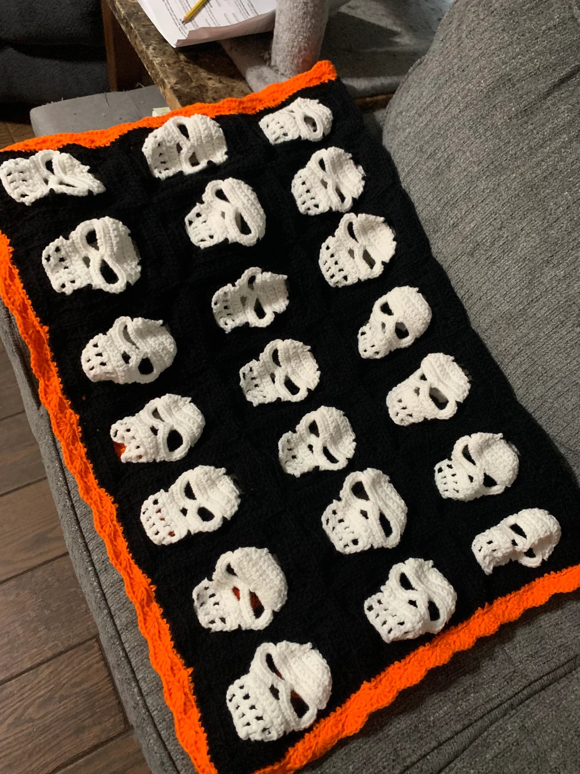 Skull Crochet Throw Blanket – Halloween Black and White Skeleton Afghan with Orange Border – Spooky Cozy Gothic Home Decor